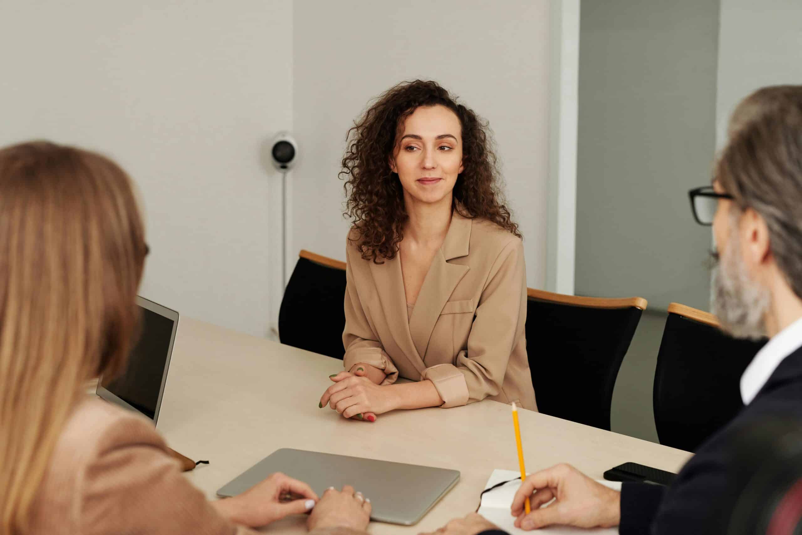 Business professionals in a meeting discussing strategies and planning for effective commercial association management.