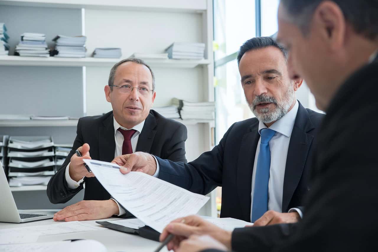 Condo management team meeting between 3 people