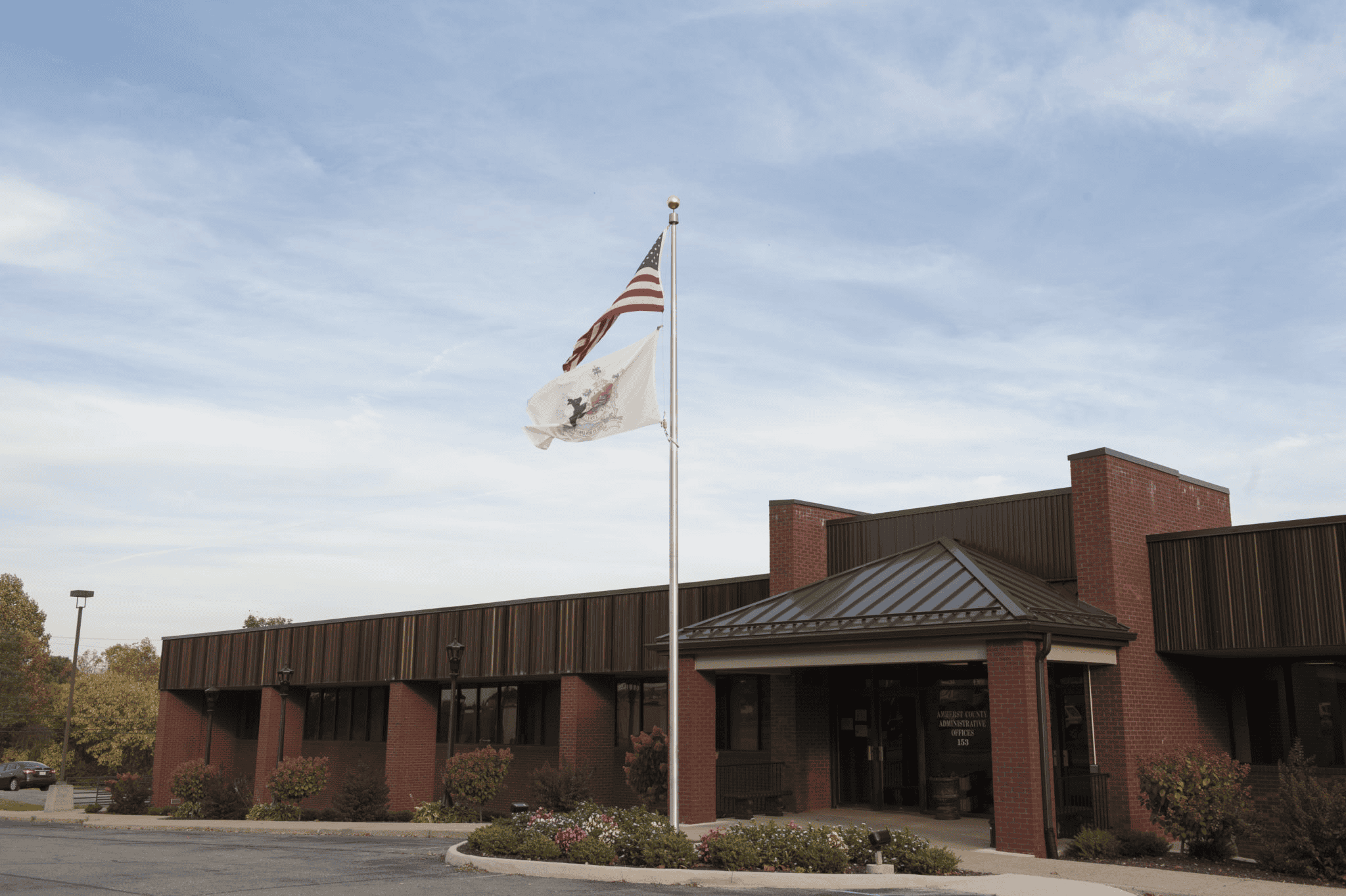 Amherst County Building with a flag in fr