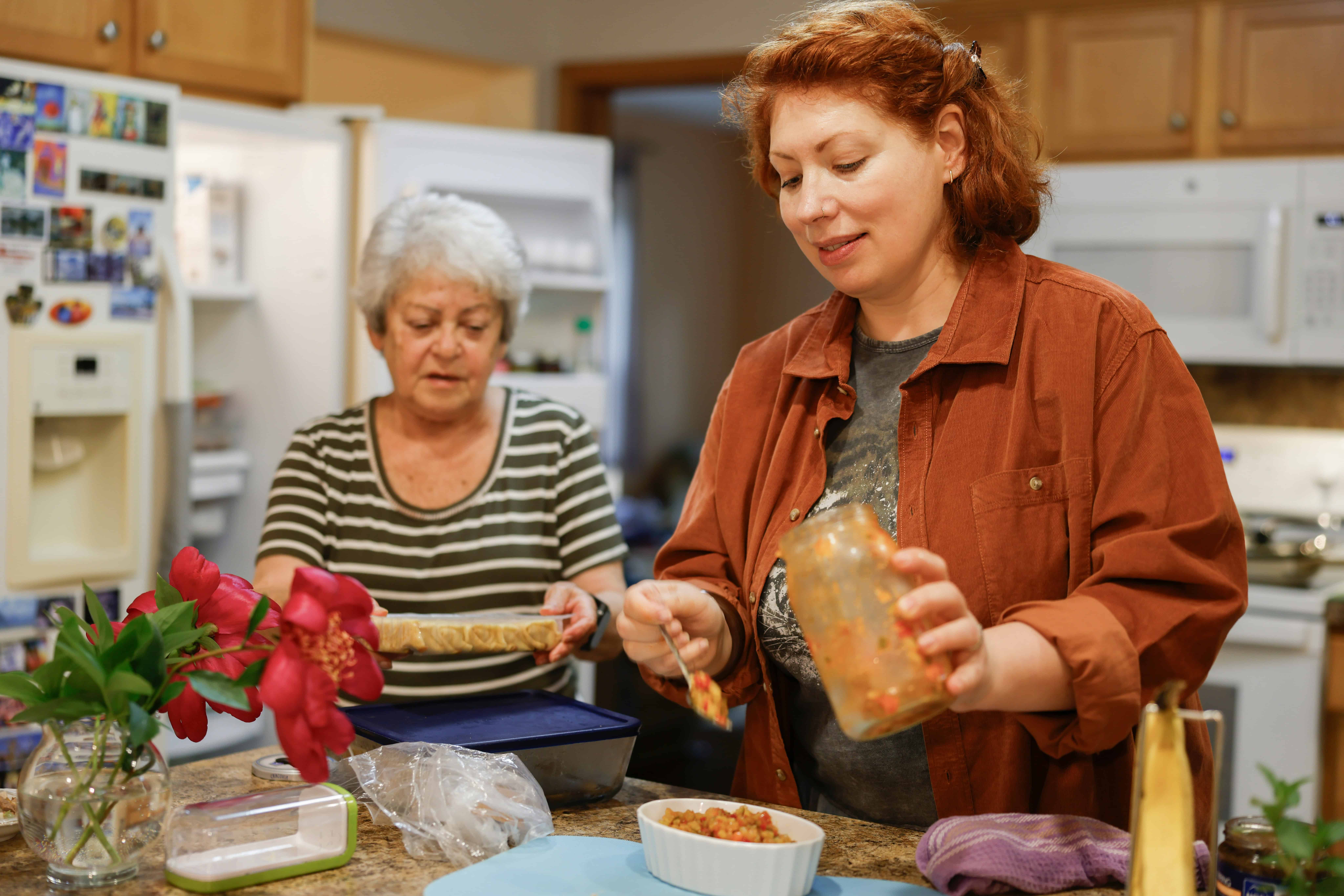Two women cook dinner in their Fairfax County home
