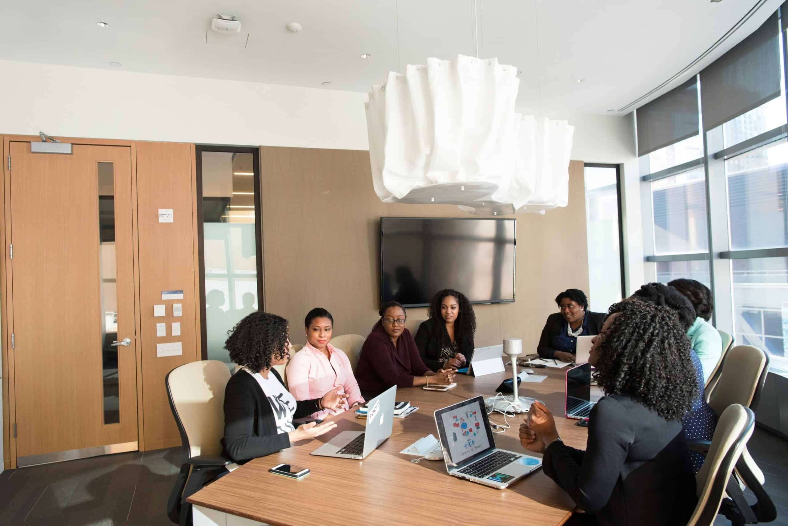 Professionals meeting around a conference table discussing plans and community initiatives in Henrico County, Virginia.